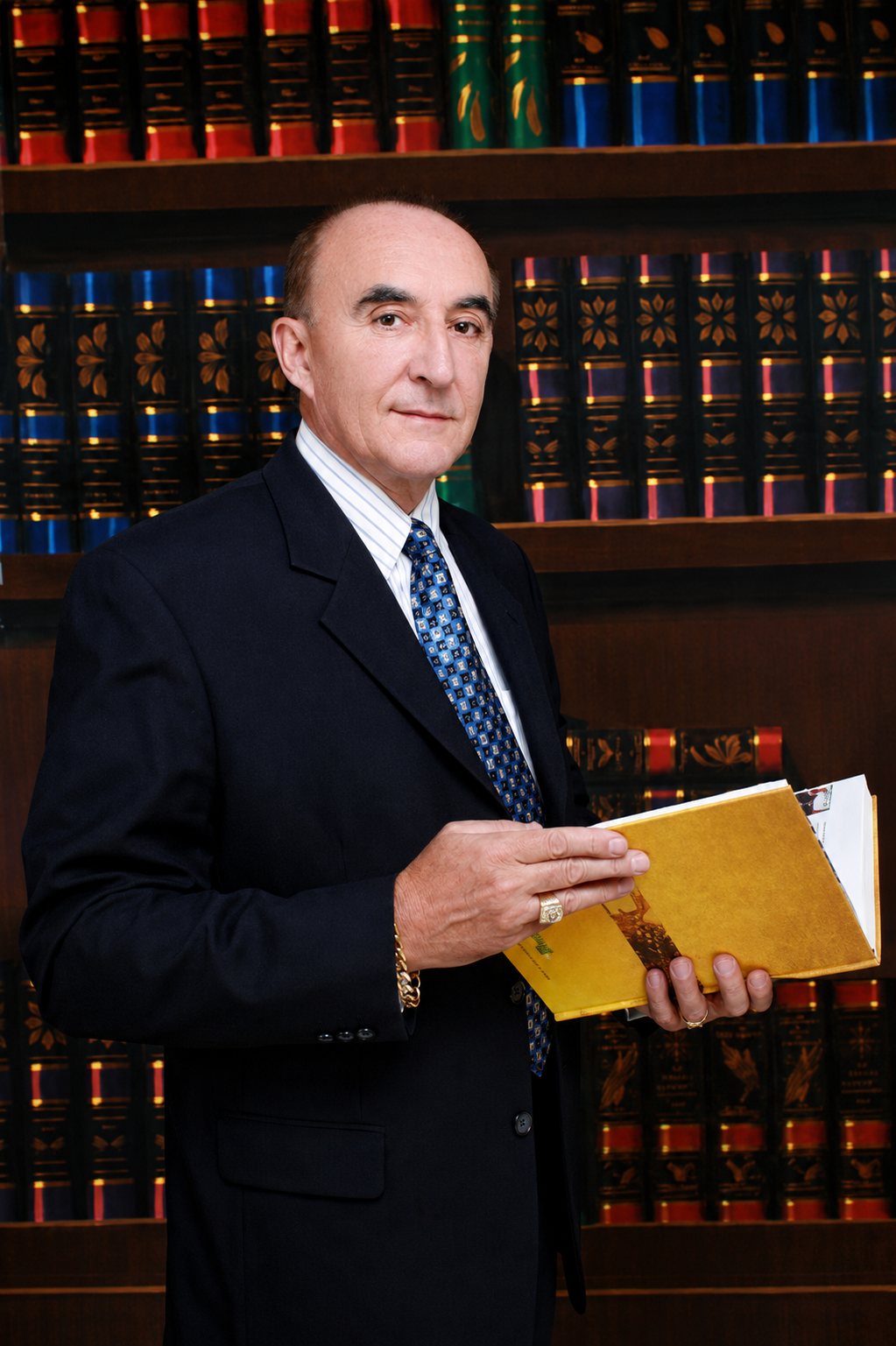 Paul King holding a document folder